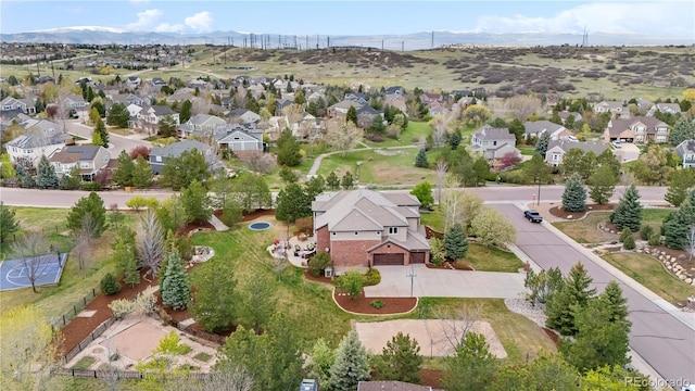 drone / aerial view with a mountain view and a residential view