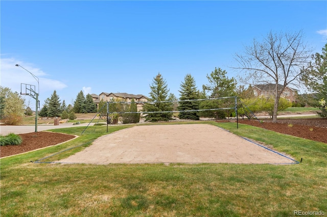 view of community with a yard and volleyball court