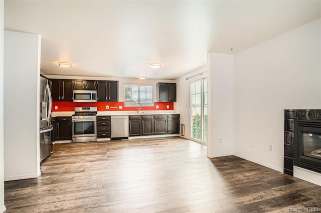 8057 Bryant St, Westminster, CO 80031 - kitchen with appliances with stainless steel finishes, wood finished floors, and light countertops