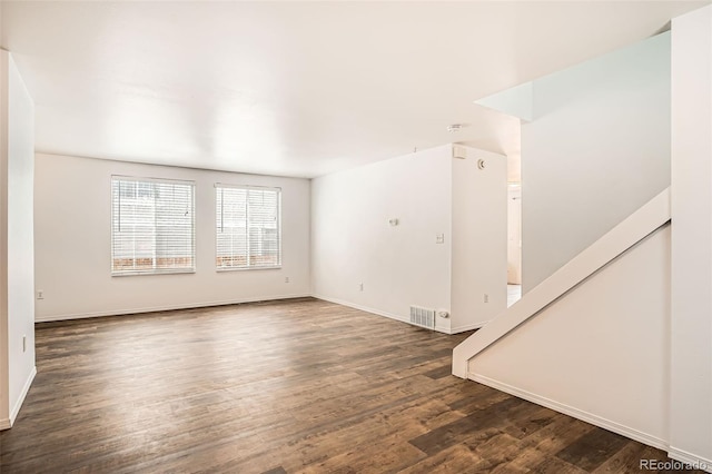 8057 Bryant St, Westminster, CO 80031 - empty room with dark wood-type flooring and baseboards