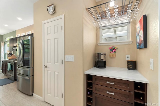 kitchen featuring appliances with stainless steel finishes and light countertops