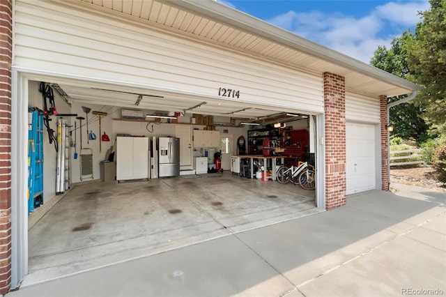 garage featuring stainless steel fridge