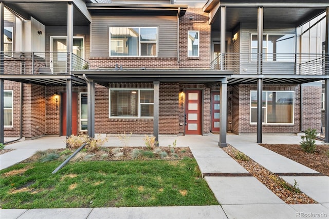 view of front of home with brick siding