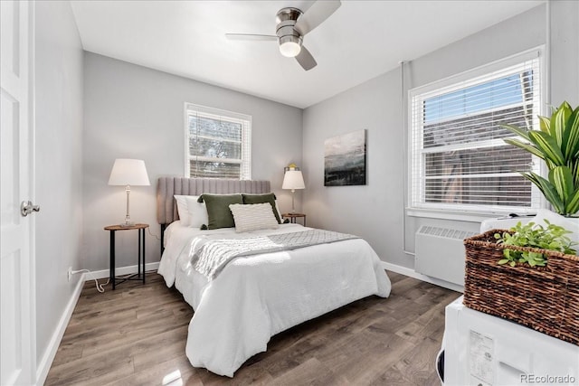 bedroom with ceiling fan and wood-type flooring