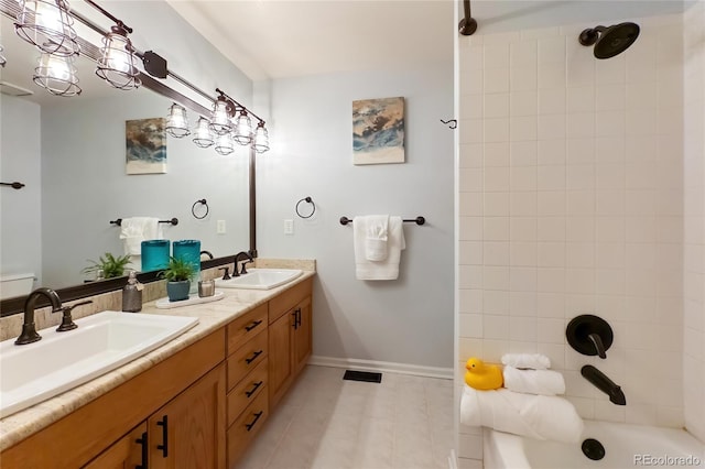 bathroom featuring a sink, baseboards, bathtub / shower combination, and double vanity