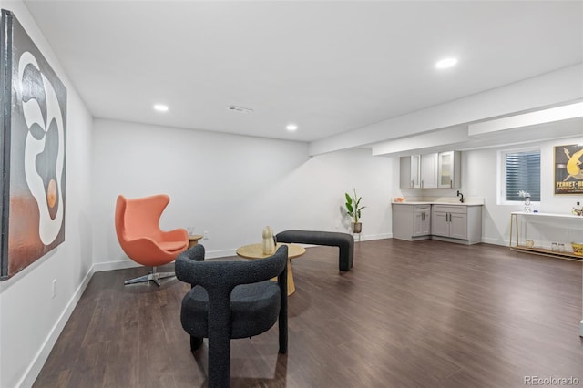 982 S Holly St, Denver, CO 80246 - sitting room featuring dark wood finished floors, baseboards, and recessed lighting