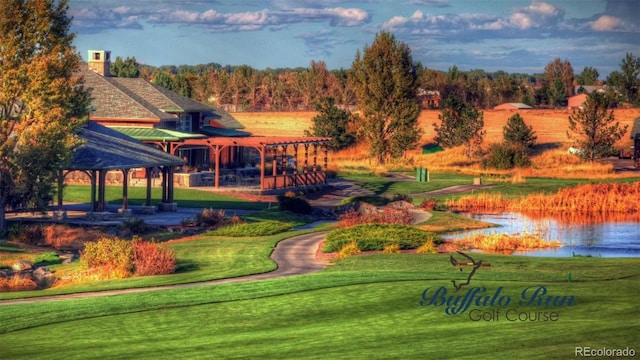 view of community with a gazebo, a water view, and a lawn