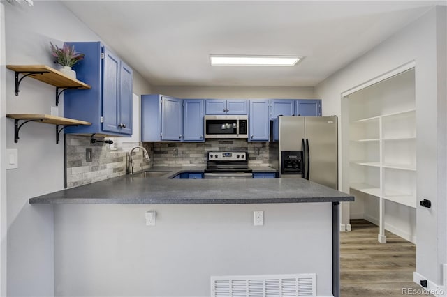 6840 Goldcrest Ct, Colorado Springs, CO 80919 - kitchen with stainless steel appliances, a sink, blue cabinets, and open shelves