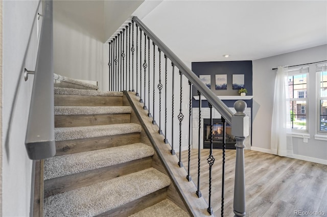 6840 Goldcrest Ct, Colorado Springs, CO 80919 - stairs with wood finished floors, baseboards, and recessed lighting