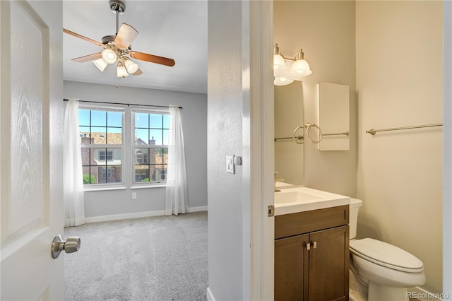 6840 Goldcrest Ct, Colorado Springs, CO 80919 - bathroom with a ceiling fan, toilet, vanity, and baseboards