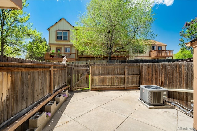 6840 Goldcrest Ct, Colorado Springs, CO 80919 - view of patio featuring cooling unit and a gate