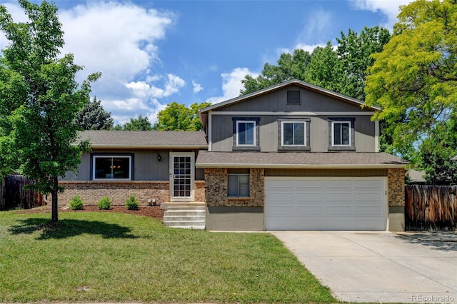 6775 Coors Ct, Arvada, CO 80004 - tri-level home featuring an attached garage, driveway, brick siding, and roof with shingles