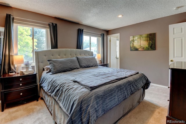 6775 Coors Ct, Arvada, CO 80004 - bedroom with light colored carpet and a textured ceiling