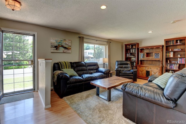 6775 Coors Ct, Arvada, CO 80004 - living room with a textured ceiling, light wood-type flooring, and recessed lighting