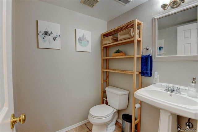 6775 Coors Ct, Arvada, CO 80004 - half bathroom featuring toilet and tile patterned floors