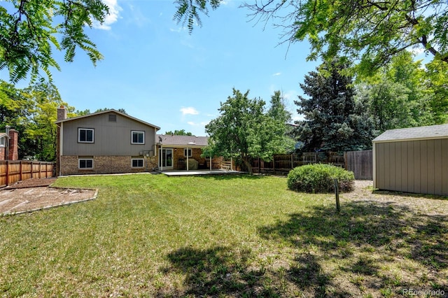 6775 Coors Ct, Arvada, CO 80004 - fenced backyard with a patio area and an outdoor structure