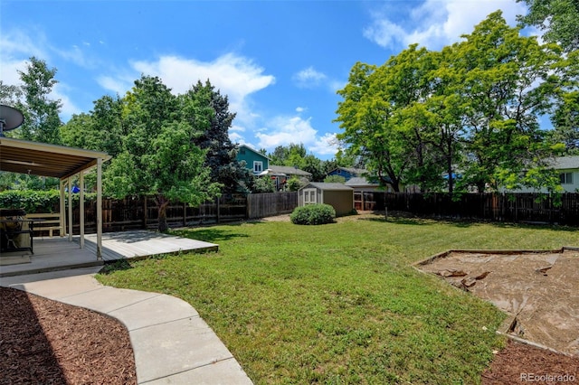 6775 Coors Ct, Arvada, CO 80004 - fenced backyard with a storage unit and a deck