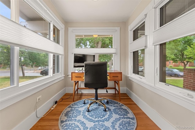 office area with a healthy amount of sunlight and wood-type flooring