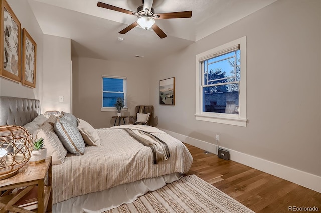 bedroom featuring ceiling fan and hardwood / wood-style flooring