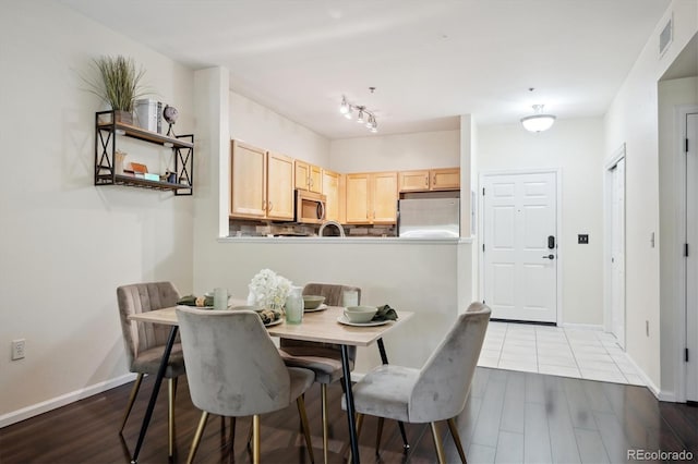 2895 W Riverwalk Cir Unit 104, Littleton, CO 80123 - dining space with wood finished floors and baseboards