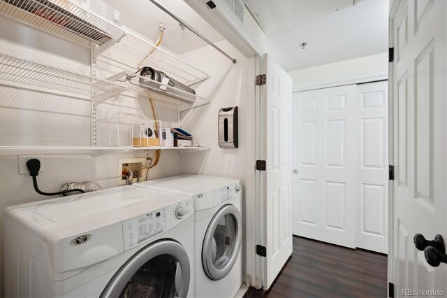 2895 W Riverwalk Cir Unit 104, Littleton, CO 80123 - laundry area with independent washer and dryer and dark wood finished floors