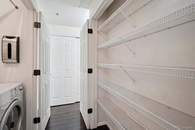 2895 W Riverwalk Cir Unit 104, Littleton, CO 80123 - laundry area with washer / dryer and dark wood-type flooring
