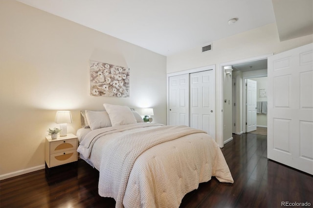 2895 W Riverwalk Cir Unit 104, Littleton, CO 80123 - bedroom featuring a closet, baseboards, and wood finished floors