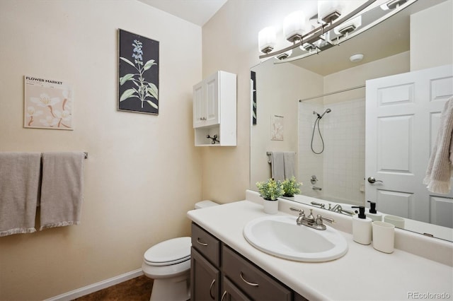 2895 W Riverwalk Cir Unit 104, Littleton, CO 80123 - bathroom featuring toilet, vanity, baseboards, and washtub / shower combination