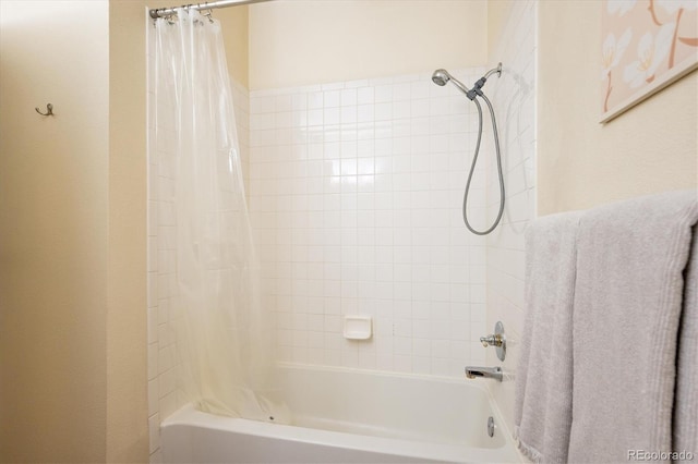 2895 W Riverwalk Cir Unit 104, Littleton, CO 80123 - bathroom with shower / bath combo with shower curtain
