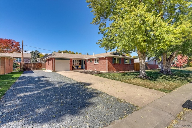 view of front of home featuring a front yard and a garage