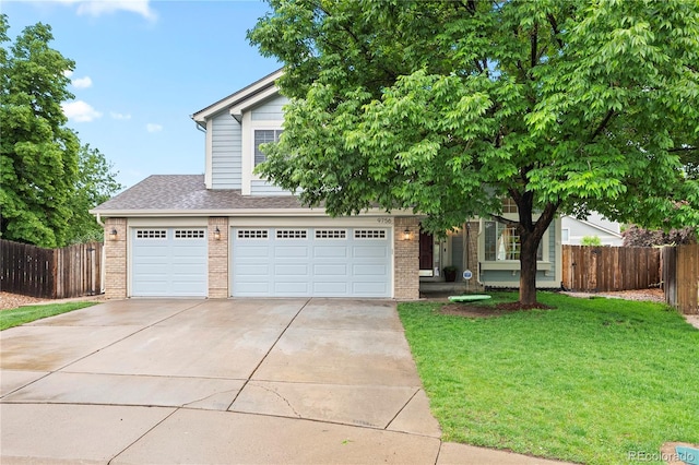 9756 Quay Loop, Broomfield, CO 80021 - obstructed view of property with brick siding, driveway, a shingled roof, and a garage