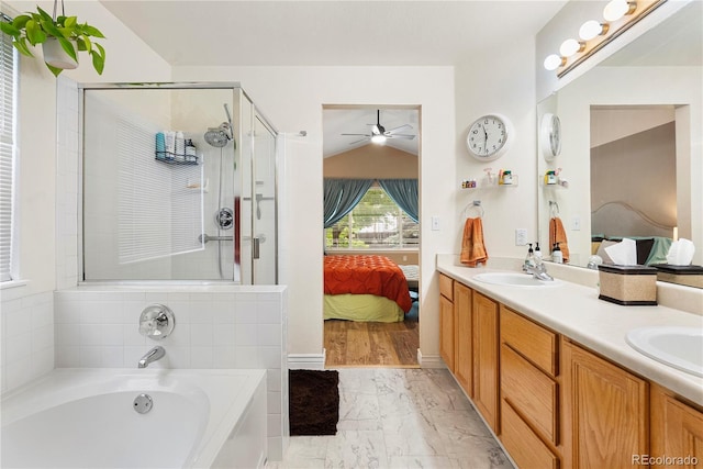 9756 Quay Loop, Broomfield, CO 80021 - ensuite bathroom with ceiling fan, marble finish floors, a garden tub, a shower stall, and vaulted ceiling