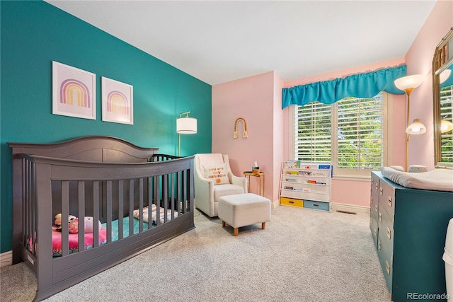 9756 Quay Loop, Broomfield, CO 80021 - carpeted bedroom with a crib and baseboards