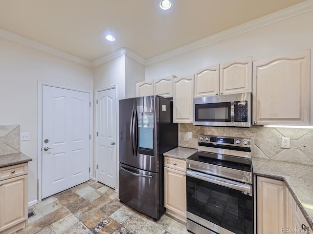 kitchen with crown molding, decorative backsplash, and stainless steel appliances