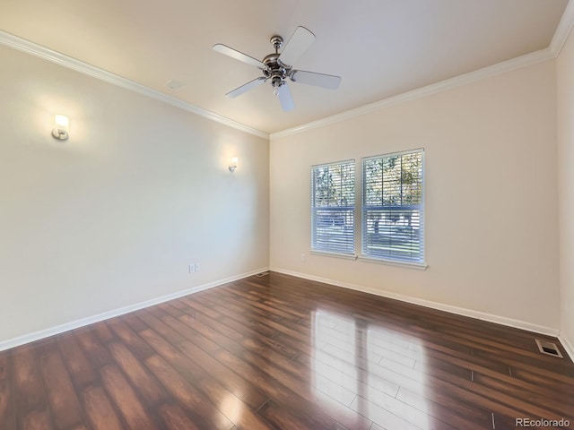 empty room with ornamental molding, ceiling fan, and dark hardwood / wood-style flooring