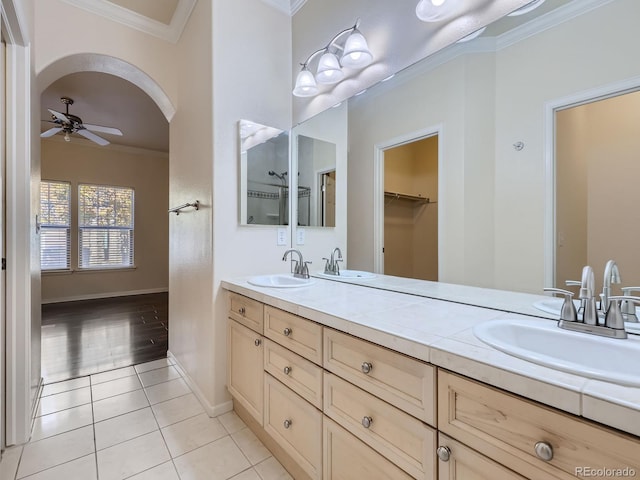 bathroom with vanity, crown molding, tile patterned flooring, and ceiling fan