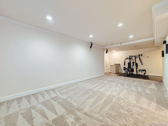 workout room with light carpet and ornamental molding