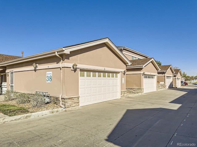 view of side of property with a garage