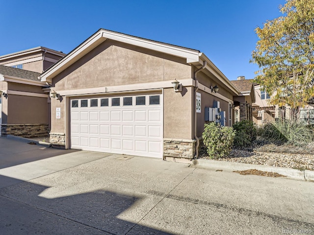 view of side of home featuring a garage