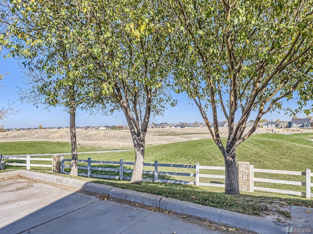 view of yard with a rural view