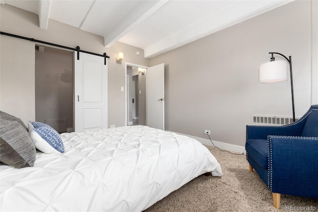 555 E 10th Ave Unit 206, Denver, CO 80203 - carpeted bedroom with beam ceiling and a barn door