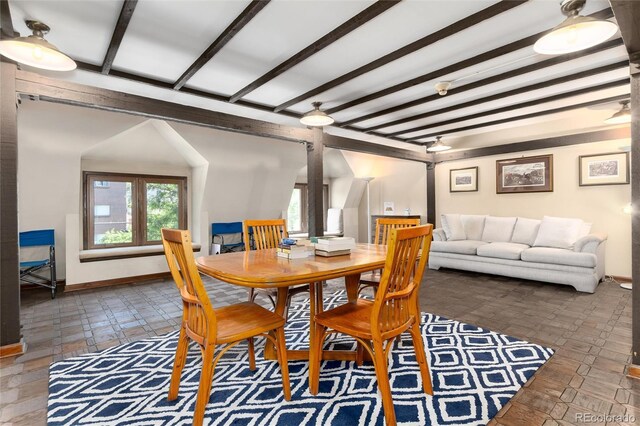 555 E 10th Ave Unit 206, Denver, CO 80203 - dining area featuring beam ceiling and ornate columns