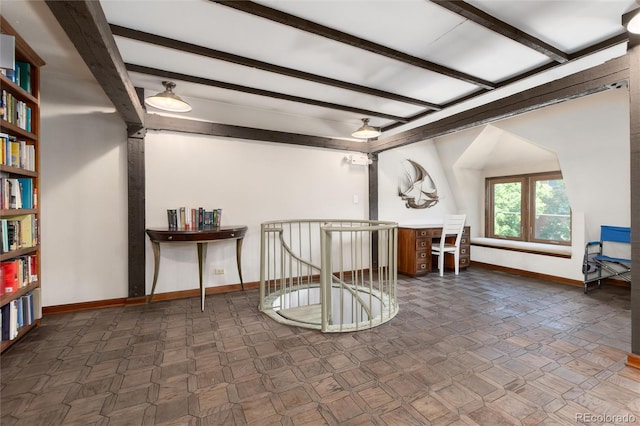 555 E 10th Ave Unit 206, Denver, CO 80203 - living area with beam ceiling and an upstairs landing