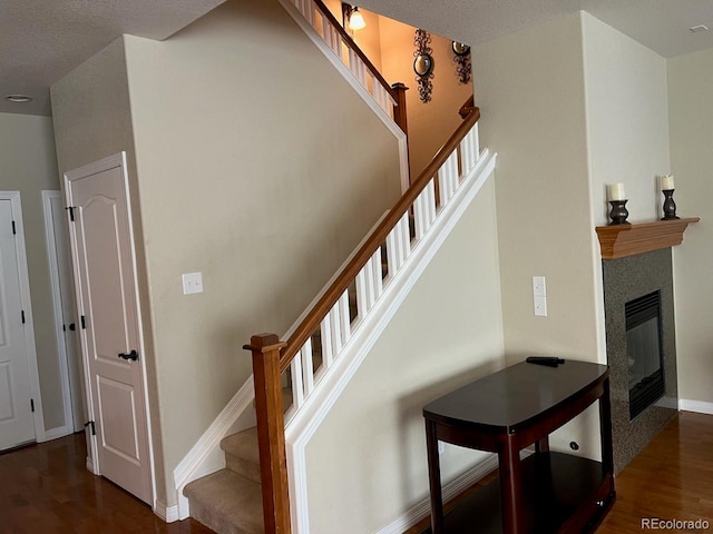 stairway with wood-type flooring