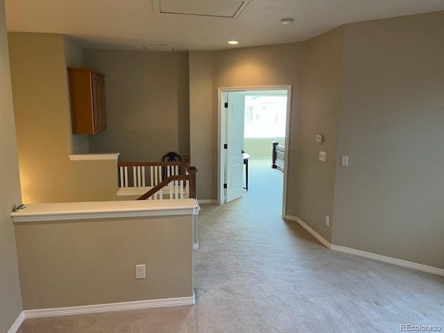 hallway with light carpet