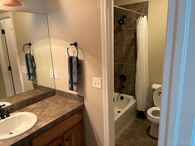 full bathroom with toilet, shower / bath combo, vanity, and tile patterned floors