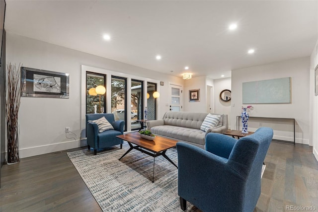 living room with baseboards, dark wood-type flooring, and recessed lighting