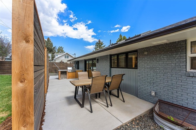 view of patio / terrace with outdoor dining space and a fenced backyard