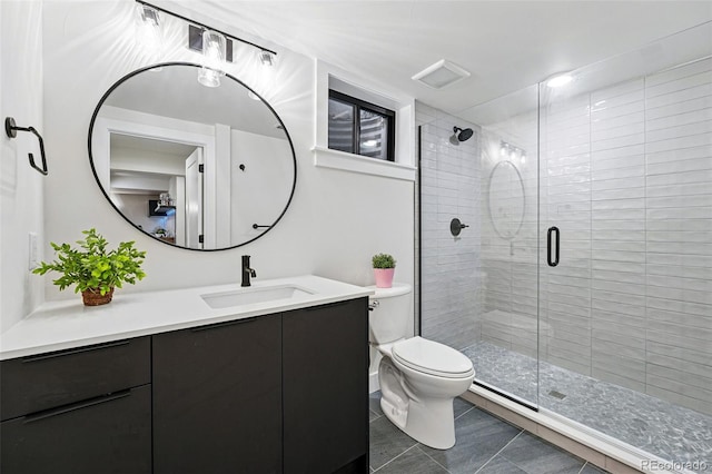 3275 19th St, Boulder, CO 80304 - full bath featuring vanity, a shower stall, toilet, and tile patterned flooring
