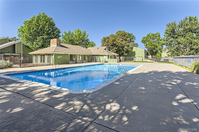 view of swimming pool with a patio area